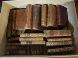a box full of old books sitting on a table