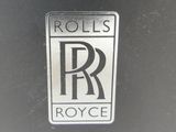 a close up of a rolls royce logo on a car