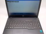 a laptop with a blue screen and keyboard on it