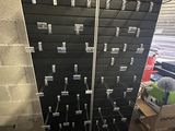 a wall of black and white boxes in a room