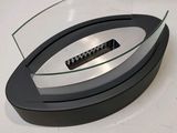 a glass table with a remote control on top of it