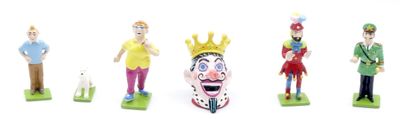 five figurines of people with different costumes on them