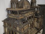 a small wooden model of a building on a table