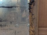 a mirror that is sitting on the floor in the room