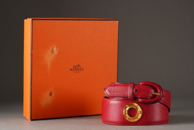 a close up of a red belt with a box in the background