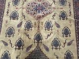 an oriental rug on a wooden floor with a cat sitting on top of it
