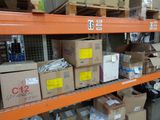 boxes are stacked on a shelf in a large warehouse