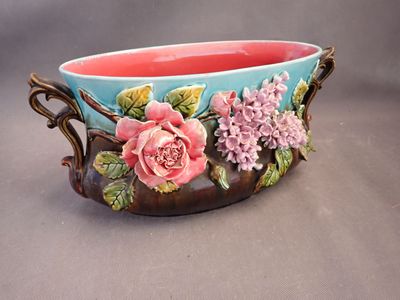 a bowl with flowers painted on it on a table