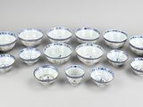 a group of blue and white bowls sitting on top of a table