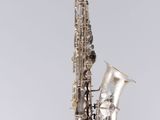 a close up of a saxophone on a white background