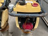 two mopeds parked next to each other on the street