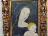 a painting of a woman holding a baby in a gold frame