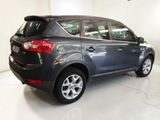 a picture of a grey car parked in a garage