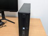 a desktop computer sitting on top of a wooden desk