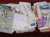 a red table with a bunch of papers on it