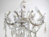 a crystal chandelier hanging from a ceiling in a room