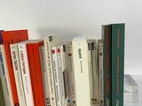 a lot of books that are lined up on a table