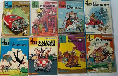 Plusieurs albums de BD sont alignés sur une surface blanche
