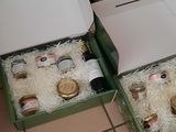 two boxes of pizza sitting on the floor next to each other