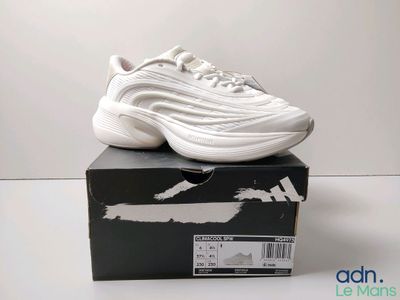 the nike air max 97 is in white on a black box