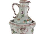 a white vase with a bird design on it