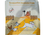 a bag of dog food that is on the ground