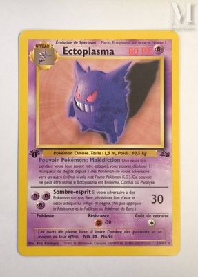 a close up of a pokemon card on a white surface