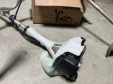 a small blower sitting on the floor next to a box