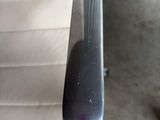 a silver spoon sitting on top of a white chair