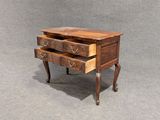 a small wooden table with two drawers on top of it