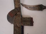 a knife and a knife rest on a table