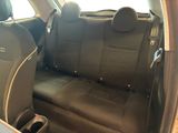 the back seats of a car with a cup holder in it