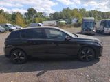 a black car that is parked in a parking lot
