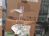 many boxes stacked on top of each other in a store