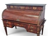 an antique writing desk with drawers and a marble top