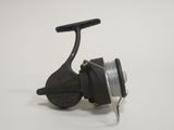 a close up of a spinning reel on a white surface