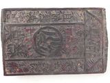 an old wooden box with a design on the front
