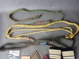 several different types of military uniforms laid out on a table