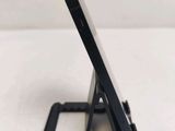 a cell phone that is sitting on top of a stand