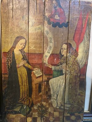 painting of a woman reading a book with an angel in the background