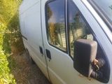 a white van that is parked on the side of the road