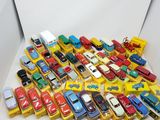 a lot of toy cars that are in a box