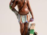 figurine of a woman with a bird and a dog