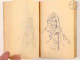 someone is holding a book with a drawing of a man in a hoodie