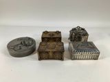 three small metal boxes and a box with a lid