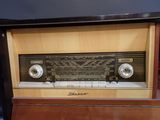 a radio that is sitting on top of a wooden table