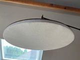 a light that is hanging from the ceiling in a room