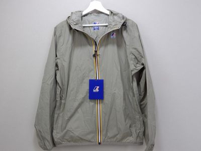 a grey jacket with a blue tag hanging on a hanger
