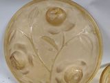 a glass bowl and a glass bowl with a flower design on it