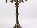 a brass table with a glass top on a white background